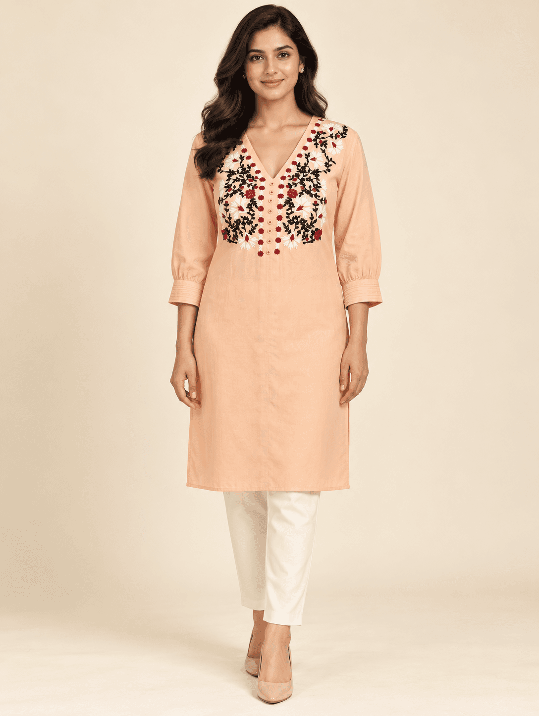 Rivalaya model in a peach embroidered kurti for suit and kurti stitching inspiration